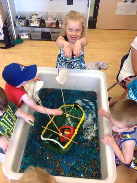 children playing with their homemade shooner